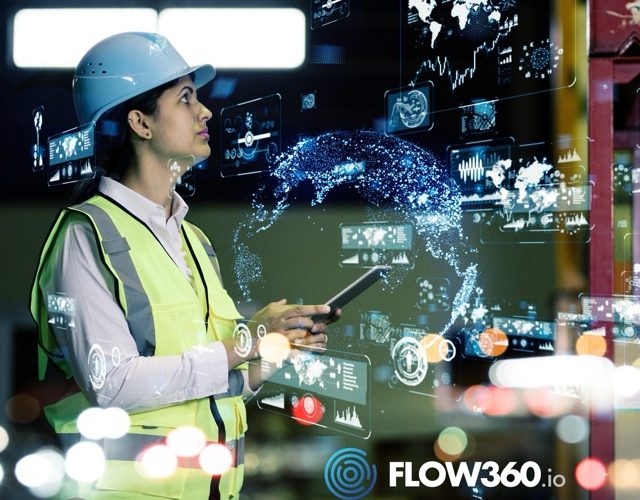 Frau in der Produktion nimmt etwas auf ihrem Tablett auf und ist von Lichtpunkten umgeben.